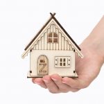 toy-house-in-hand-on-a-white-background-business-concept-buy-construction-mortgage-hand-sale-housing_t20_goQNRx